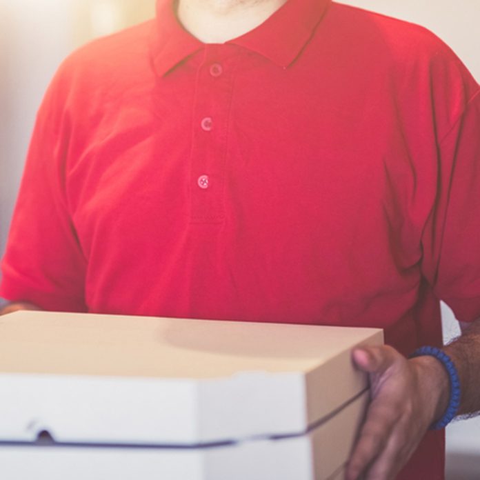 Pizza delivery man in red shirt