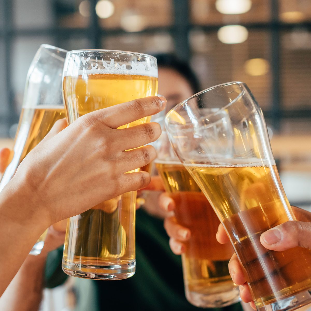 Close-up cropped image of friends clinking with beer in cafe; Shutterstock ID 684411964; Job (TFH, TOH, RD, BNB, CWM, CM): Taste of Home