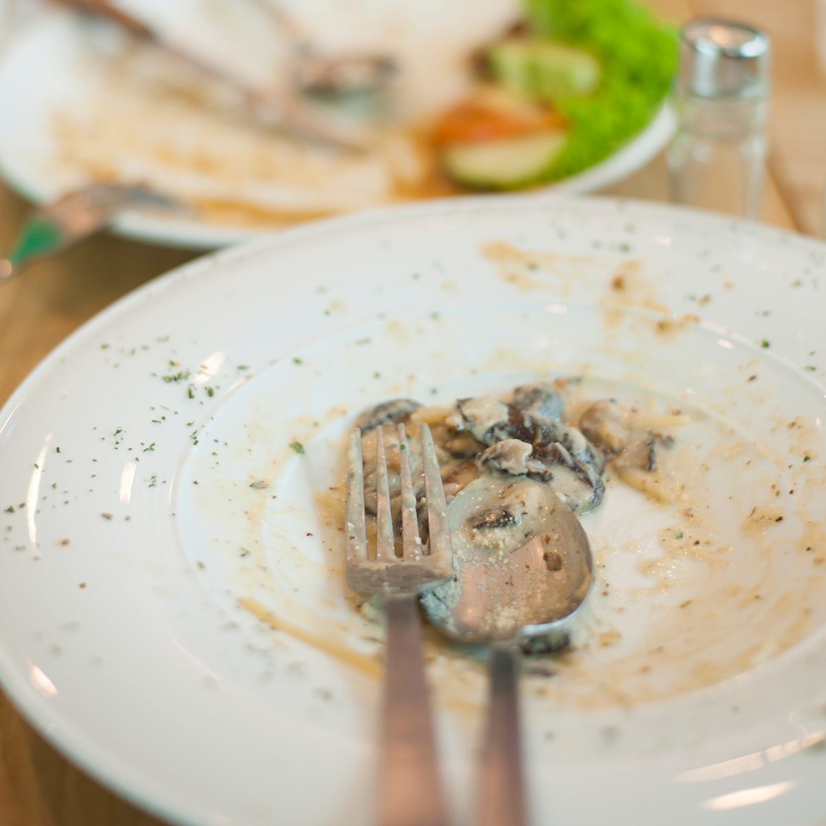 Some people had a good meal and almost finished up everything on the dining table in a cafe.