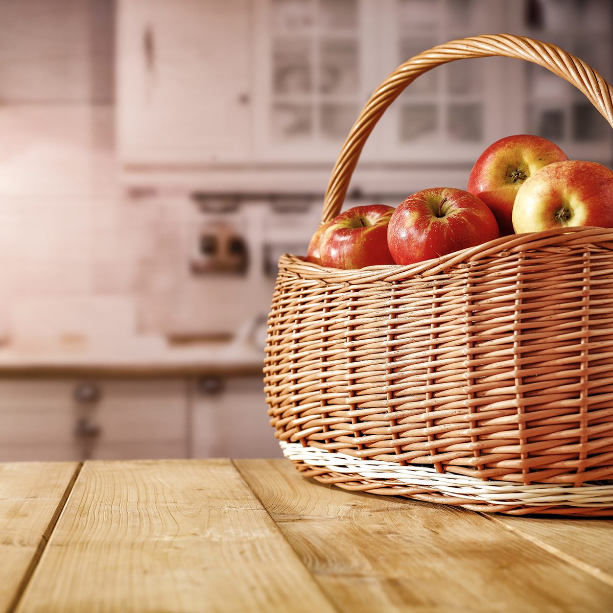Pumpkin apples on wooden table in autumn kitchen