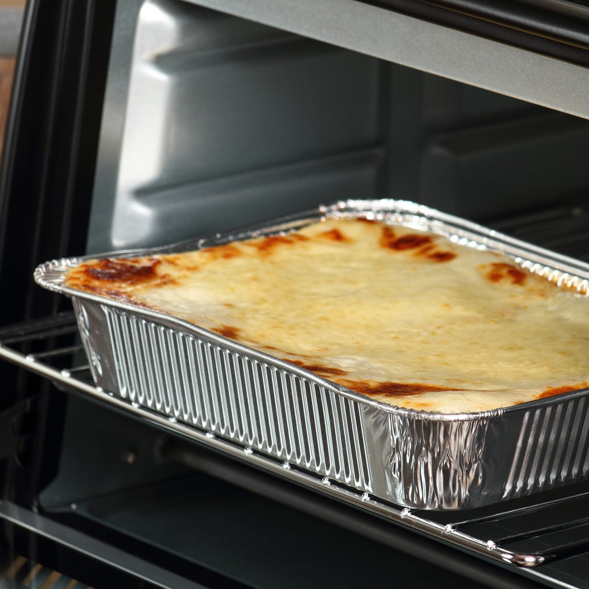 Baking Lasagne Bolognese in Disposable Foil Dish in Electric Oven