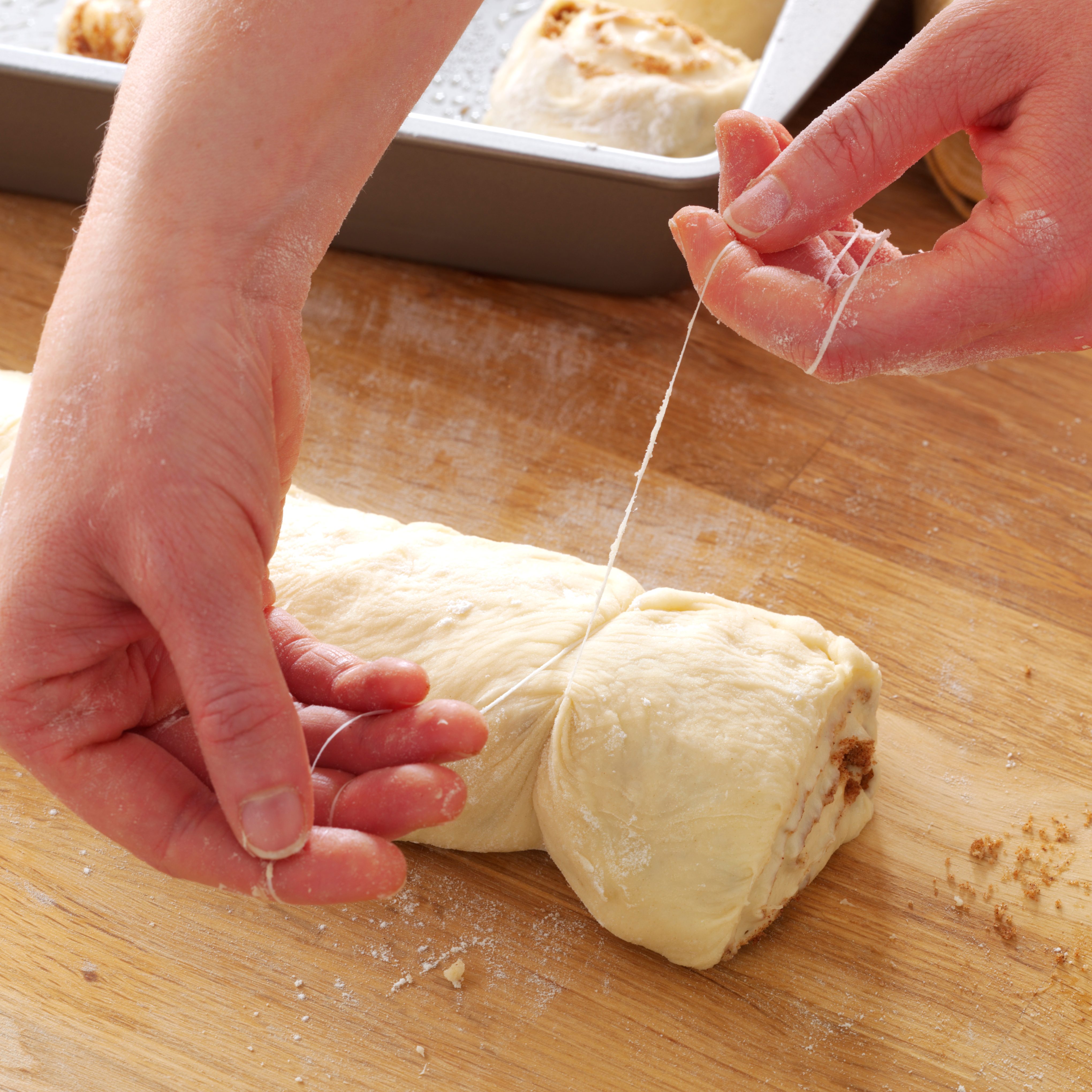 cutting cinnamon rolls with dental floss