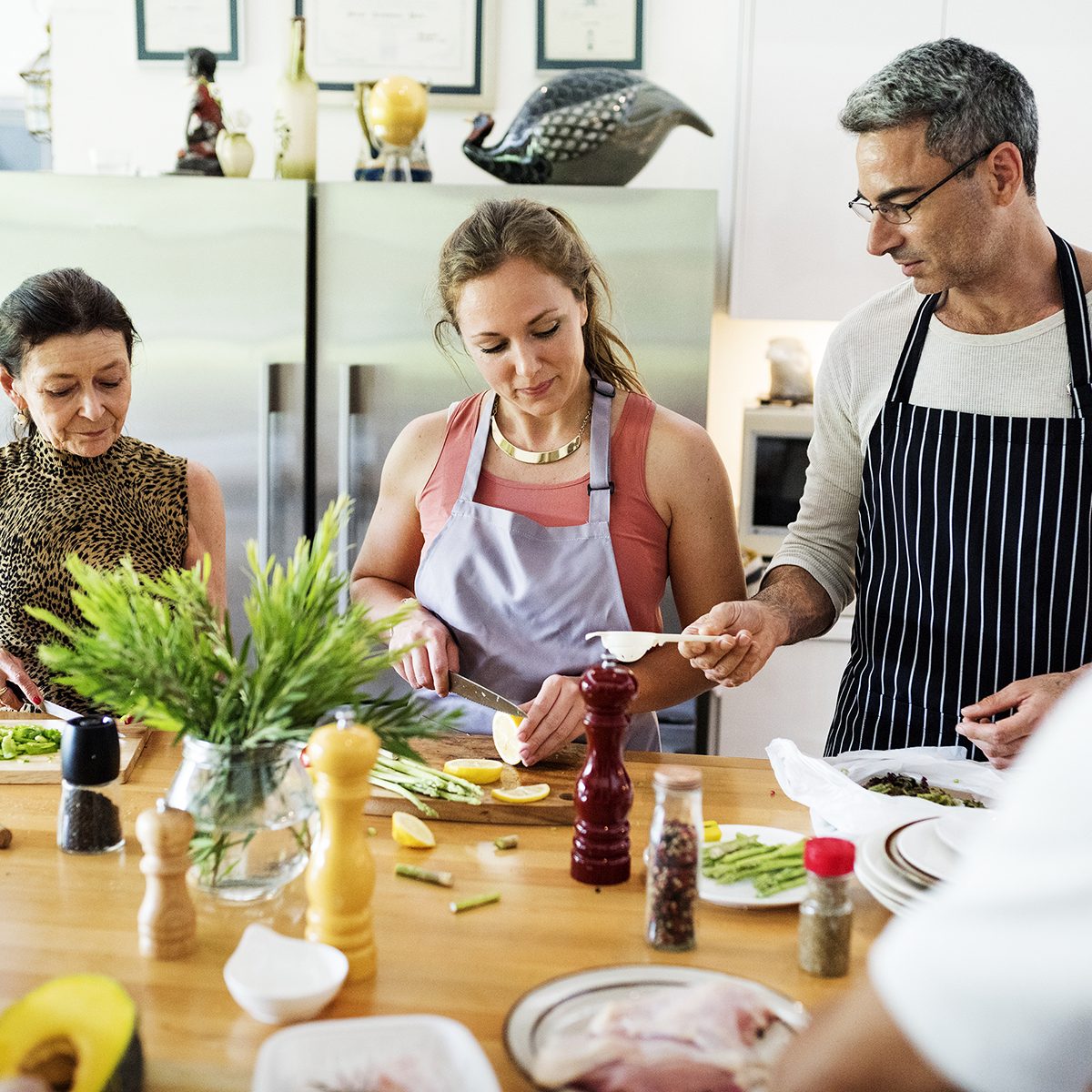 Group of friends are cooking in the kitchen