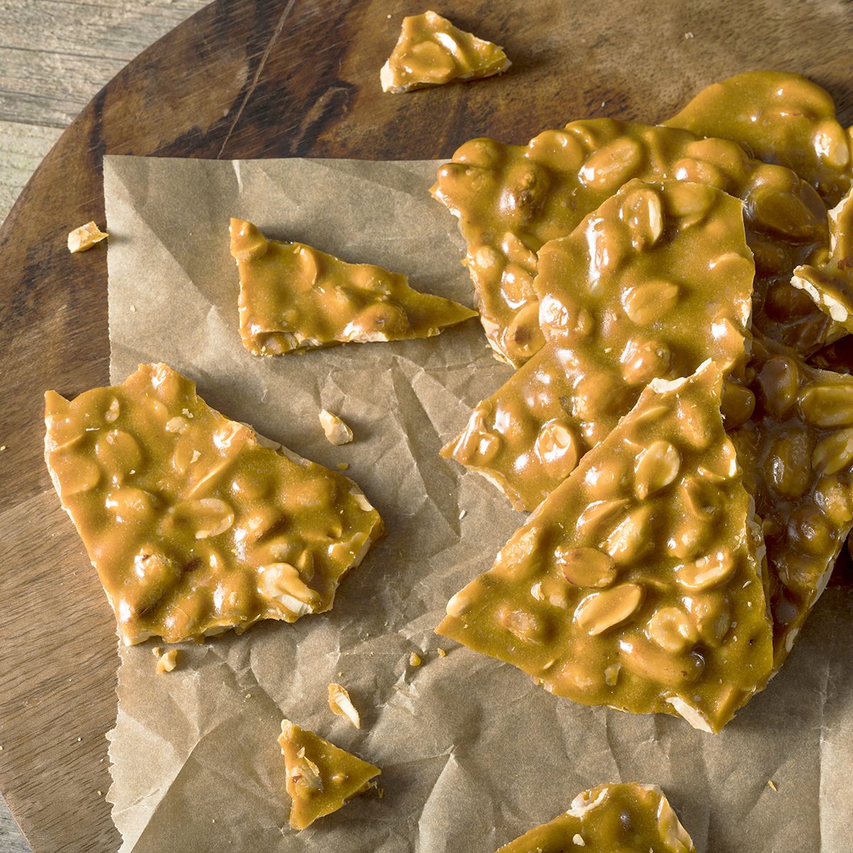 Homemade Holiday Peanut Brittle Broken into Pieces; Shutterstock ID 532125379; Job (TFH, TOH, RD, BNB, CWM, CM): TOH