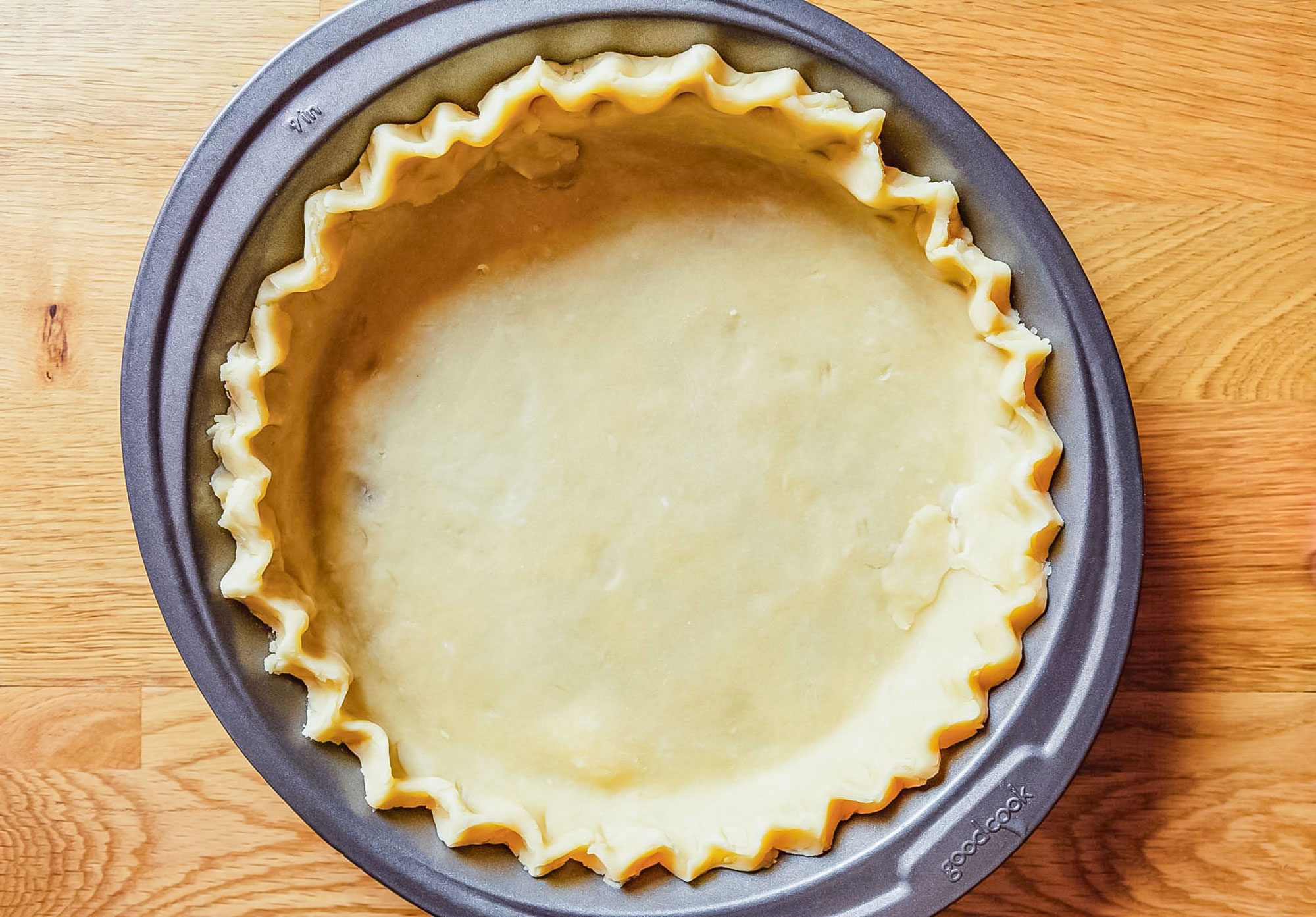 Dairy Free Pumpkin Pie Dough Laid Down on a Baking Plate