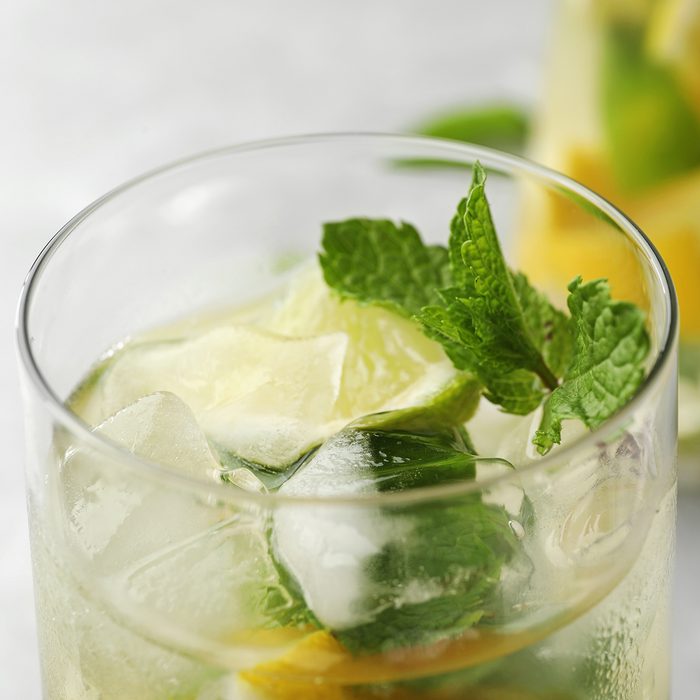 Glass of refreshing lemonade with mint on table, closeup. Summer drink; Shutterstock ID 1441602839; Job (TFH, TOH, RD, BNB, CWM, CM): TOH