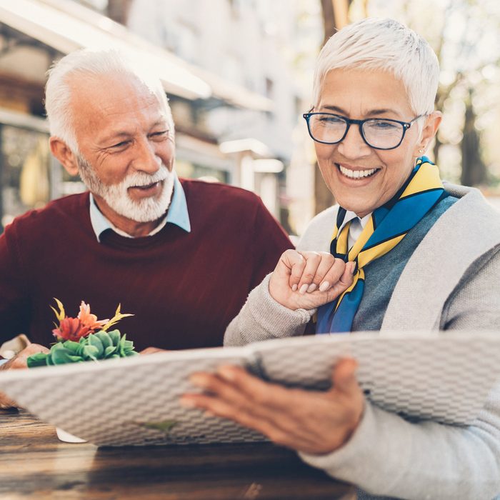 Senior couple looking at a menu in a restaurant