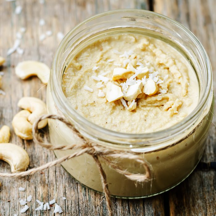 toasted cashew coconut butter on a dark wood