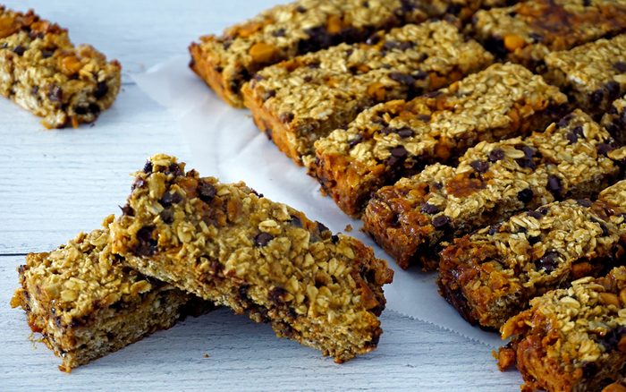 baked gluten-free granola bars scattered and stacked together