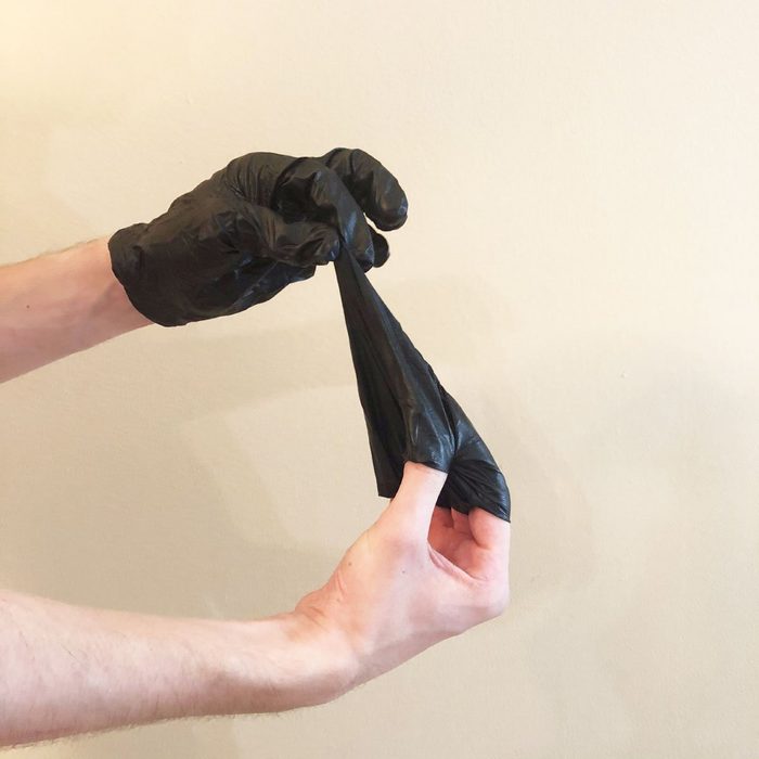 Step 2 of removing gloves