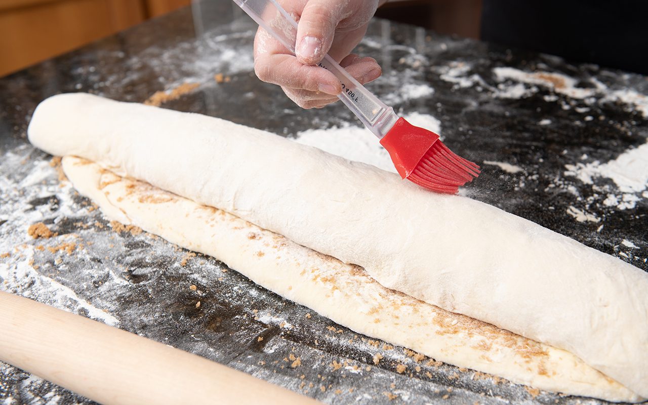 Cristen Clark rolling her dough up jelly roll style