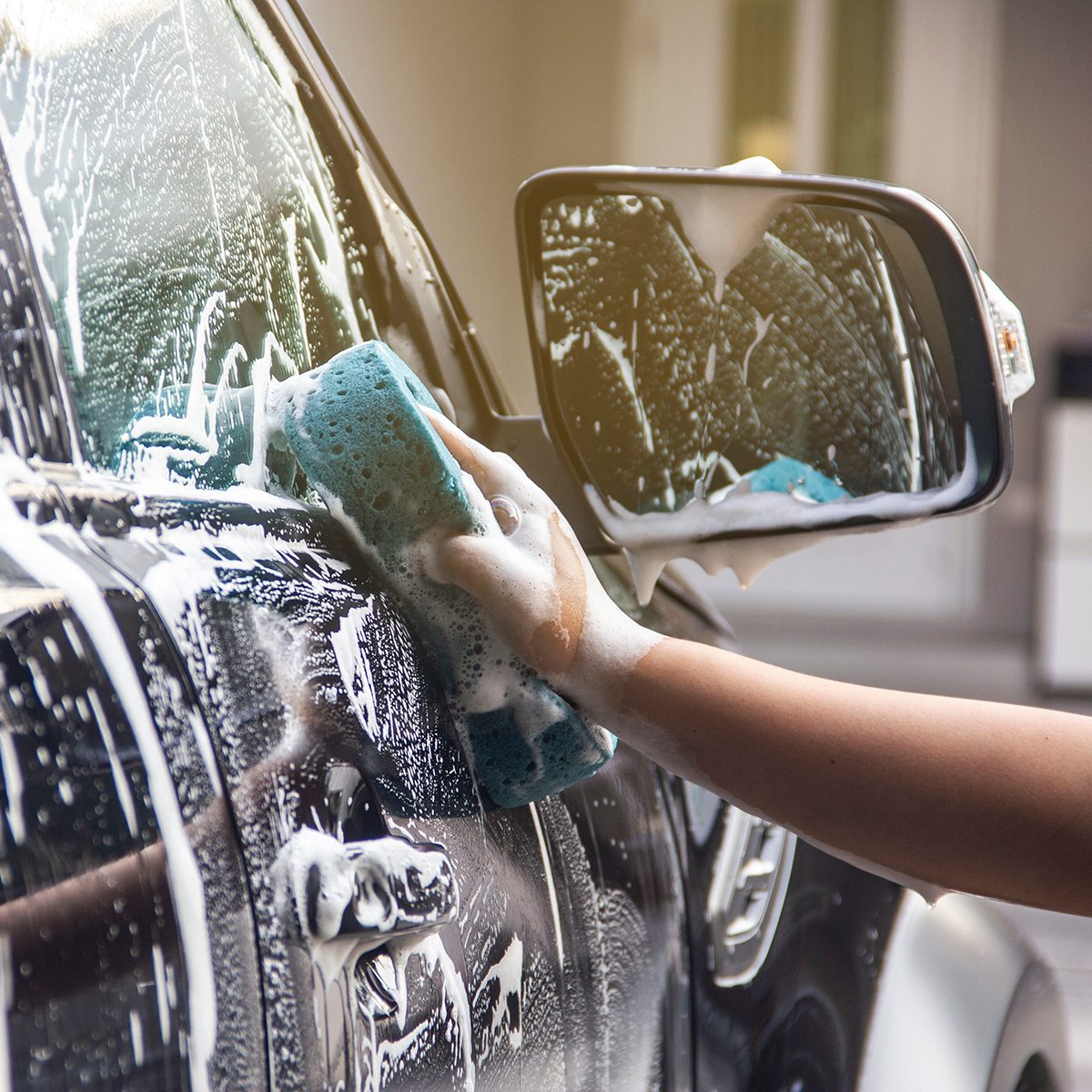 Cropped Hand Cleaning Car