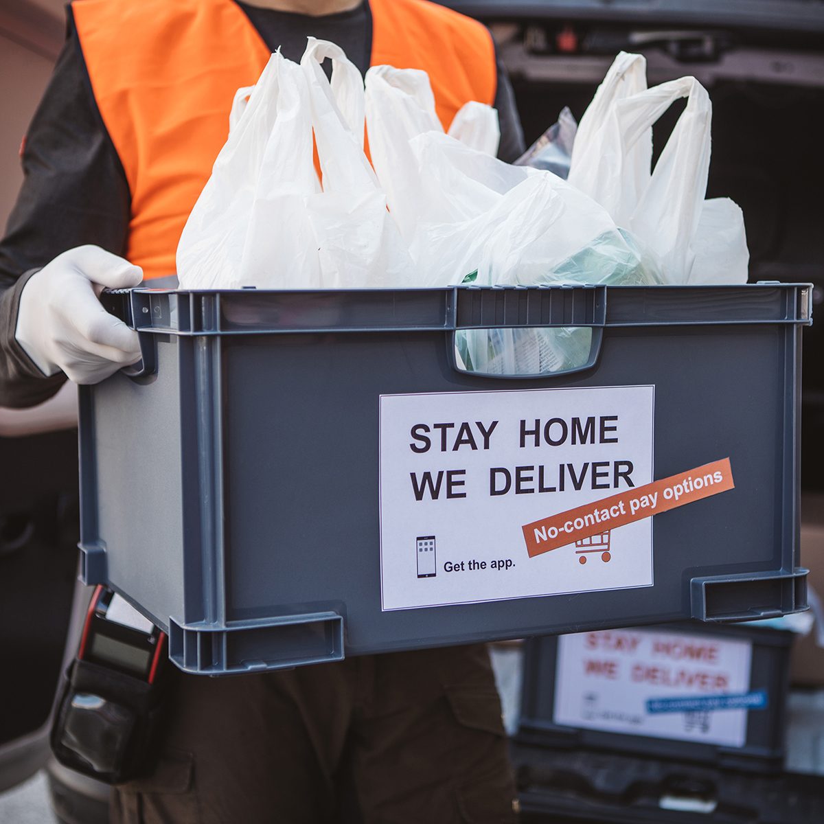 GROCERY SHOPPING RE-IMAGINED Food Trends Report, Delivering food ordered online while in home isolation during quarantine. Stay home we deliver sign on box.
