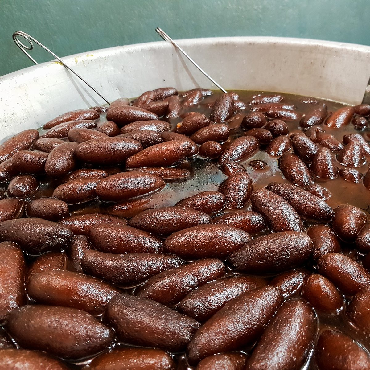 fried long sweet lyancha of shaktigarh dipped in sugar syrup. lengcha