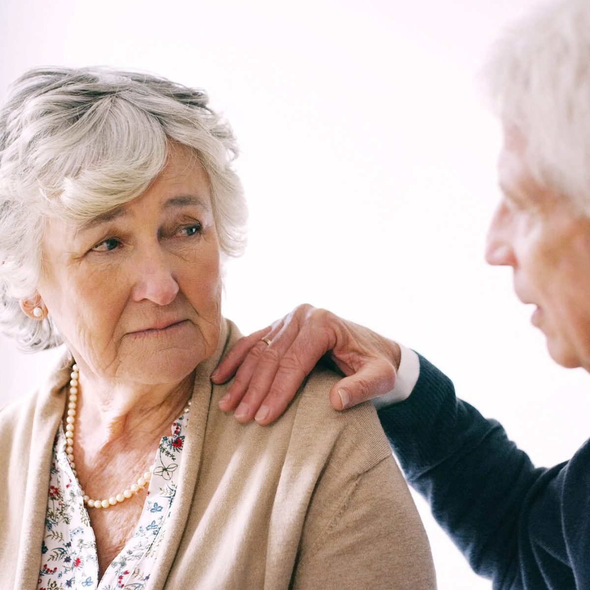 Shot of a senior man comforting his wife at during a conversation at home