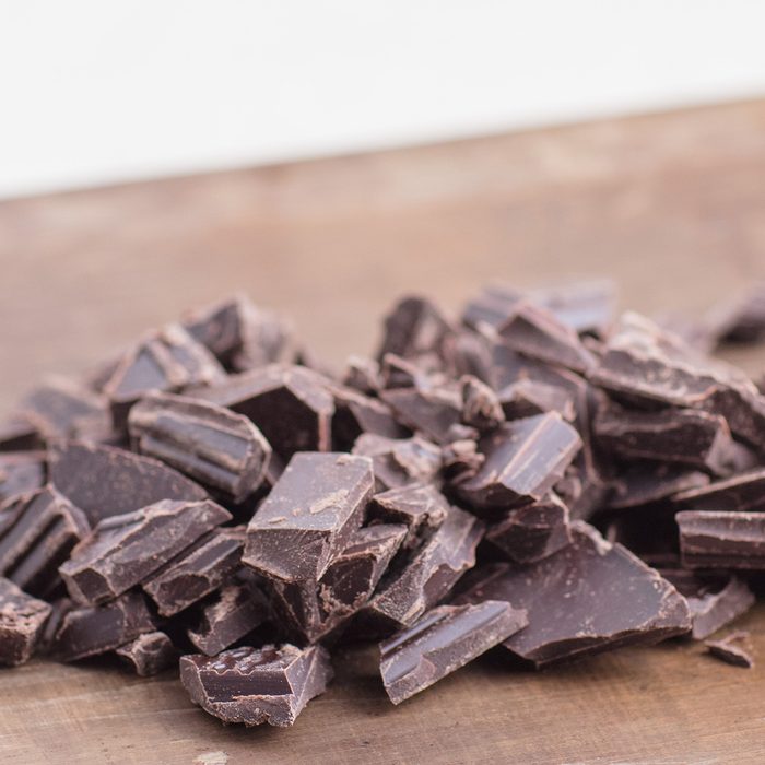 Chopped Chocolate On Wooden Board.
