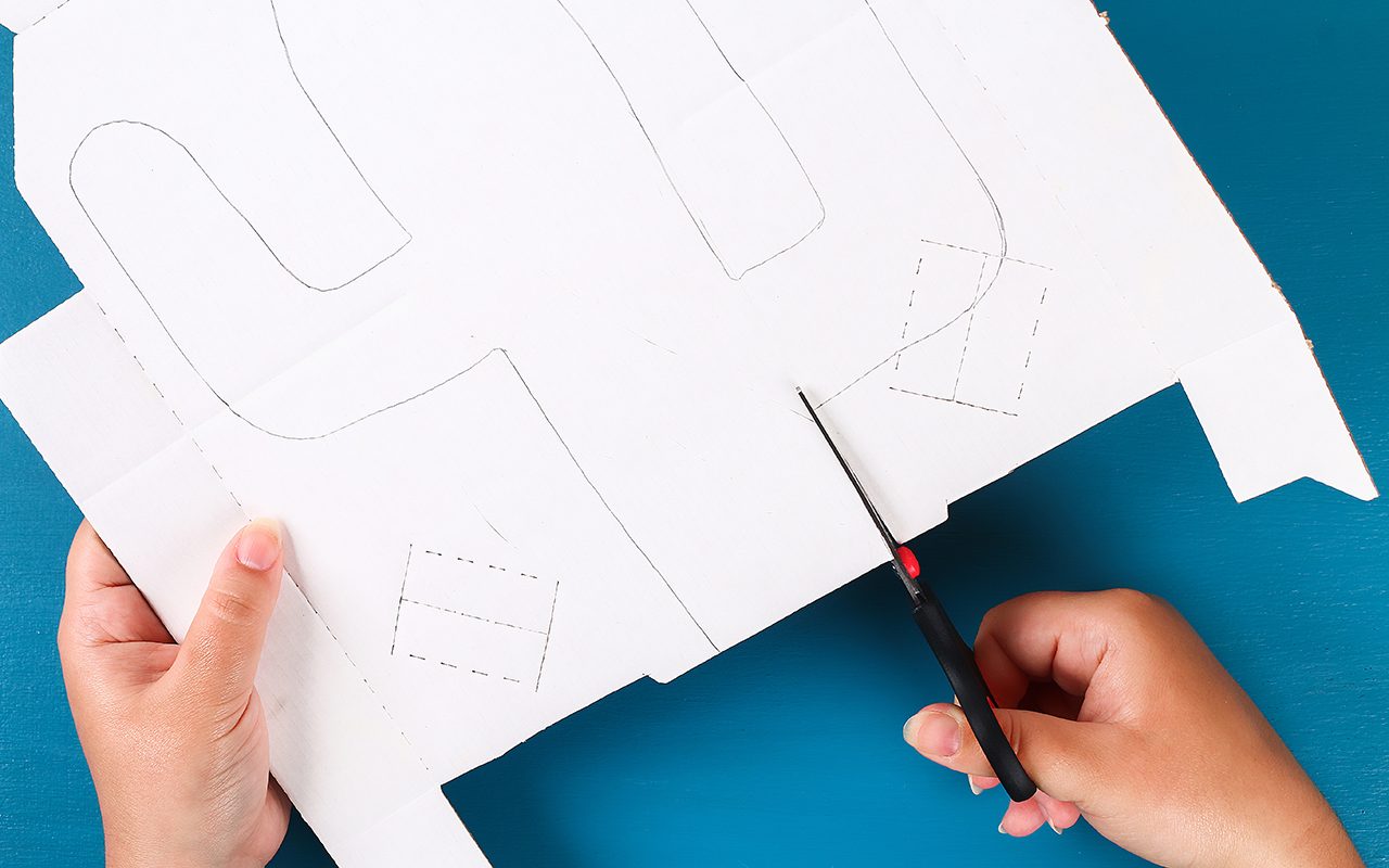 how to make a pinata Diy cinco de mayo Mexican Pinata Cactus made cardboard and crepe paper your own hands on a blue background. Gift idea, decor, game cinco de mayo. Step by step. Top view. Process kid children craft.