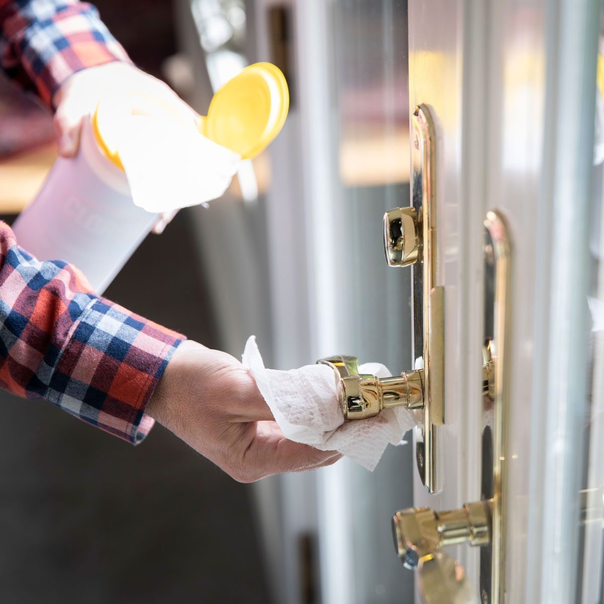 Cleaning Door Knob Gettyimages 1212838139