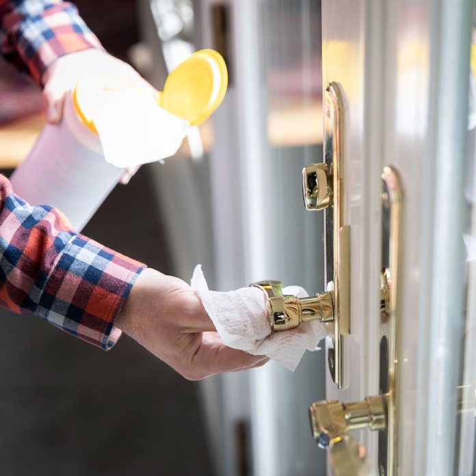 Cleaning Door Knob Gettyimages 1212838139