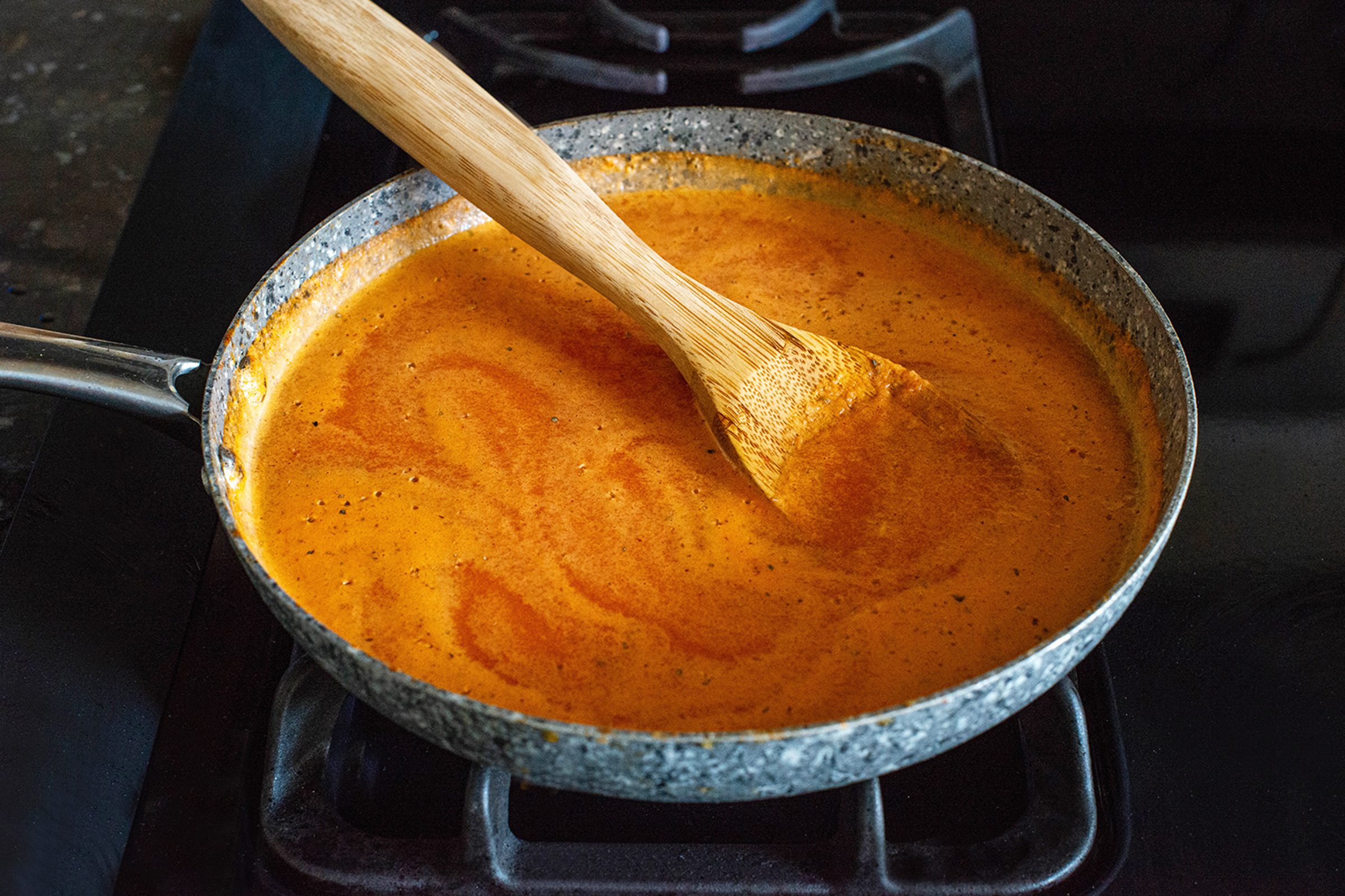 Cooking Tomato Sauce For Chiles Rellenos on stovetop
