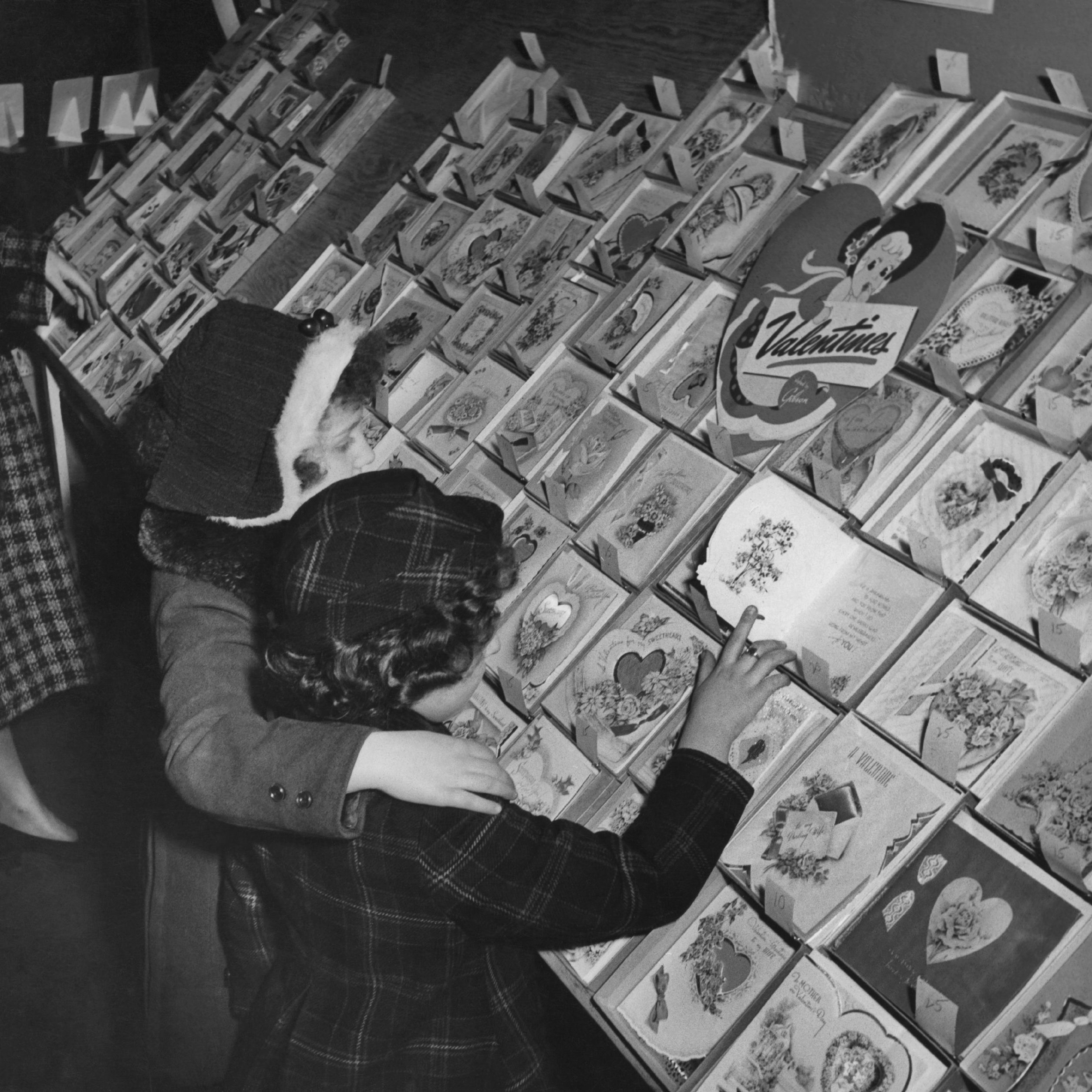 Two little girls browsing at a stall selling a wide range of Valentine