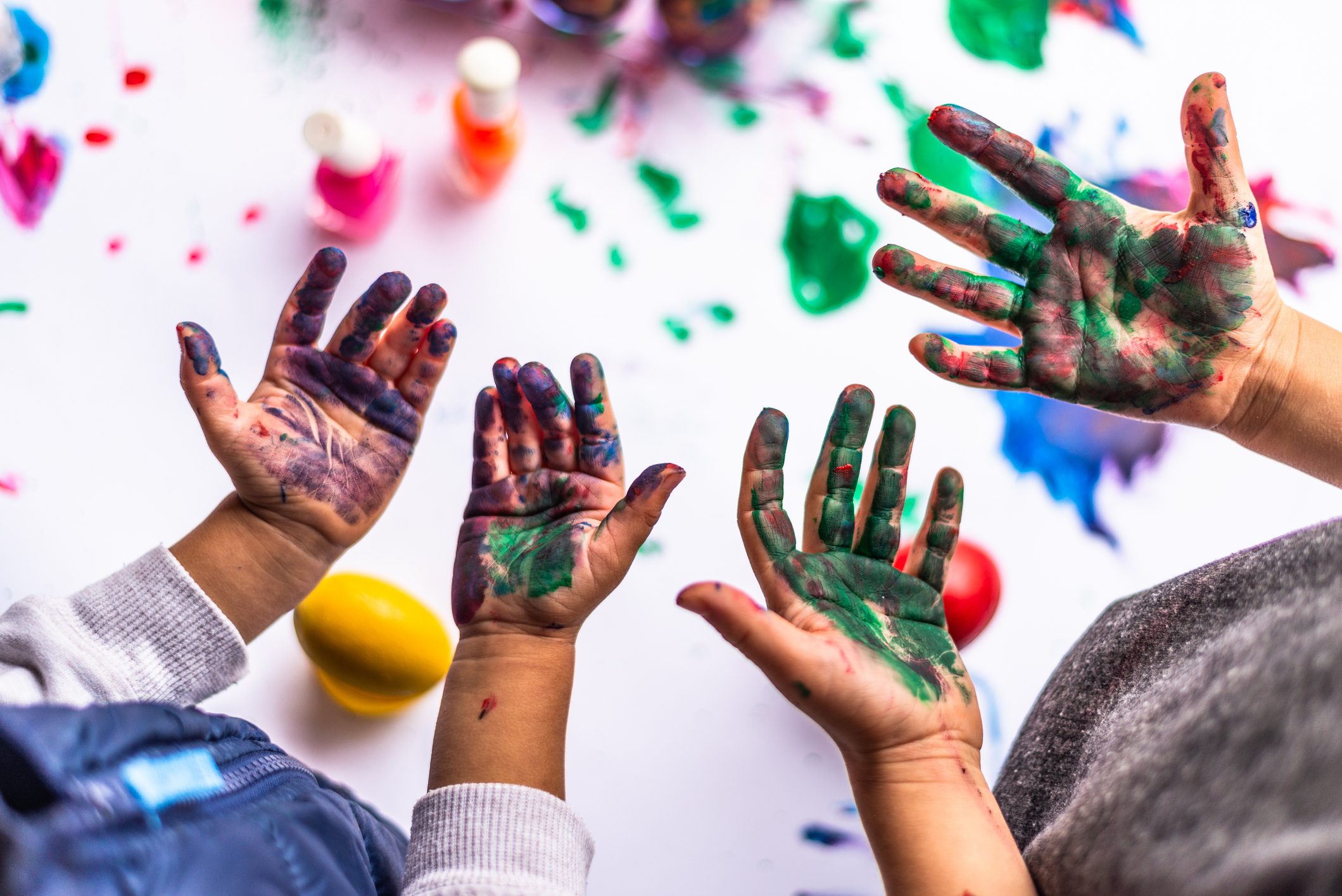 4 Hands covered in paint after a day of painting