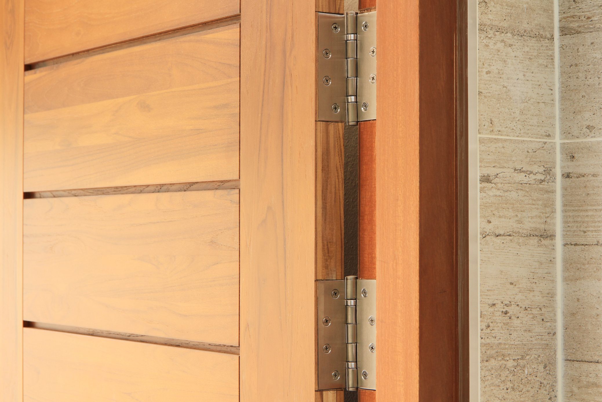 Wooden door with double hinges