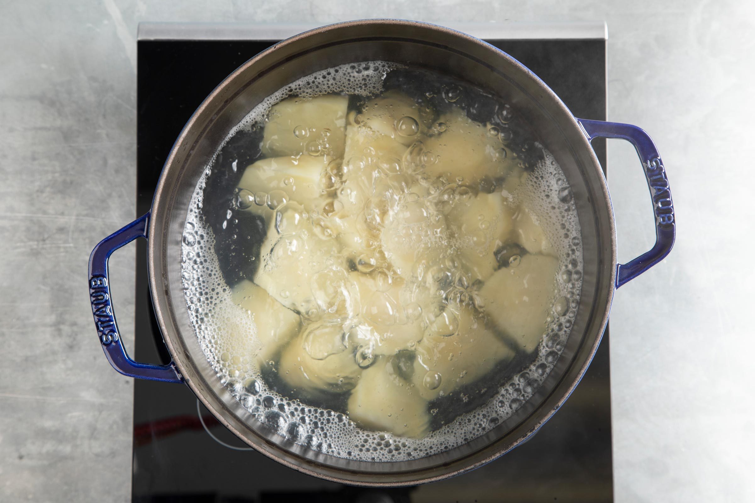 potatoes boiling in a pan