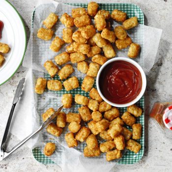 Prepared Tots a tray with a bowl of ketchup