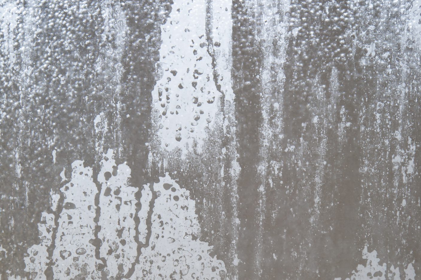 cloudy glass shower door close up