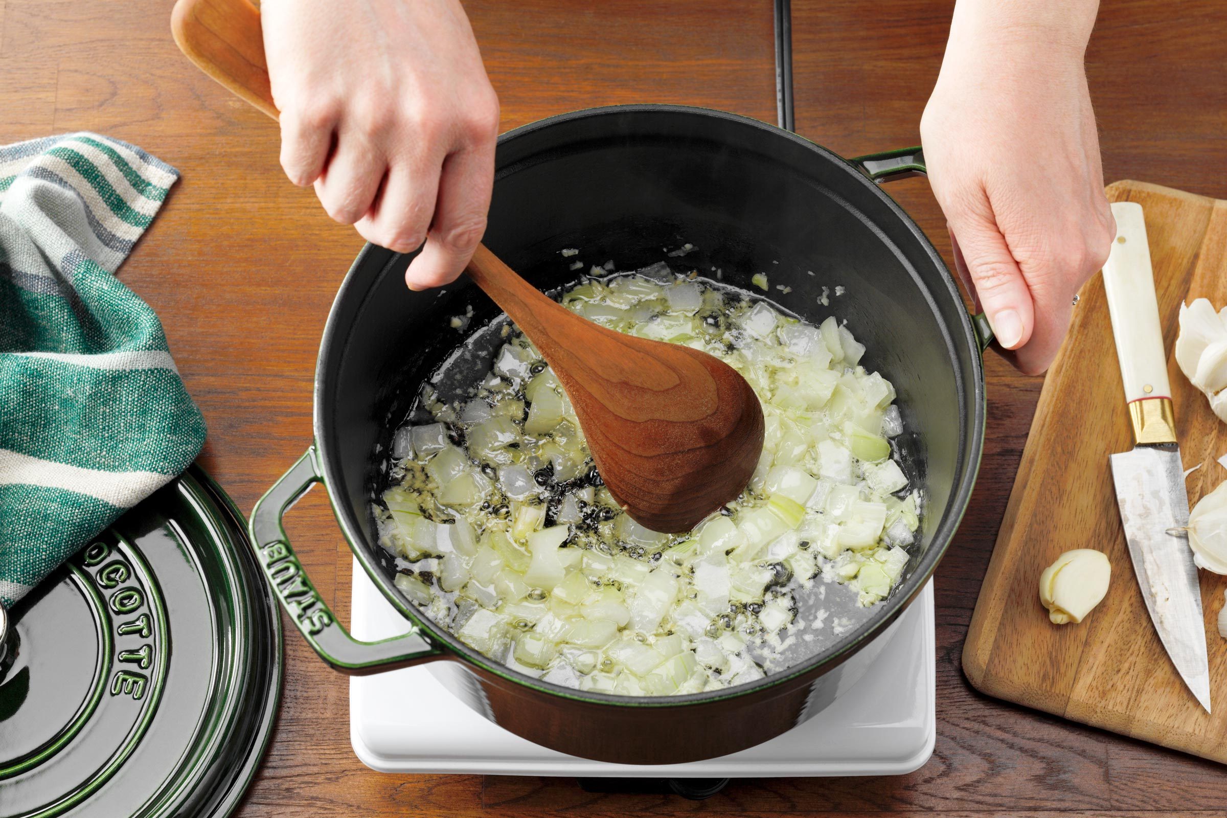 saute onions and veggies in a pot