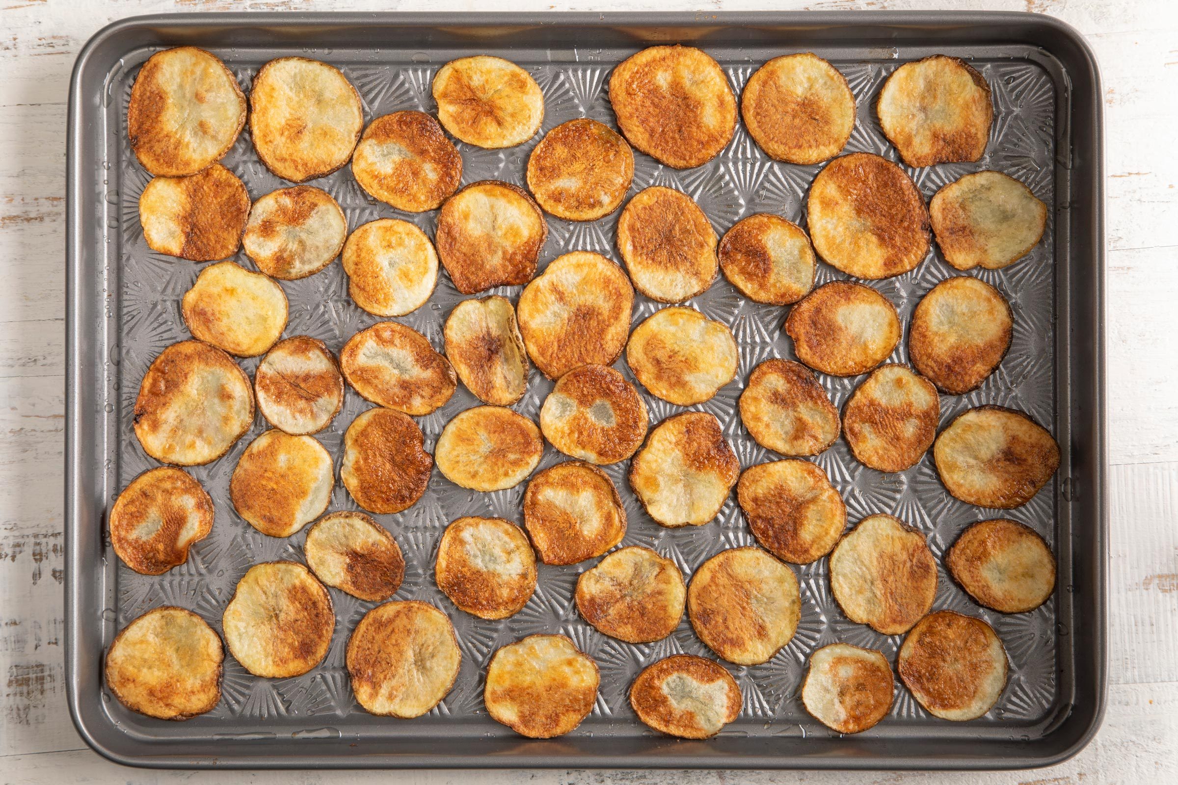 baked chips on a baking sheet