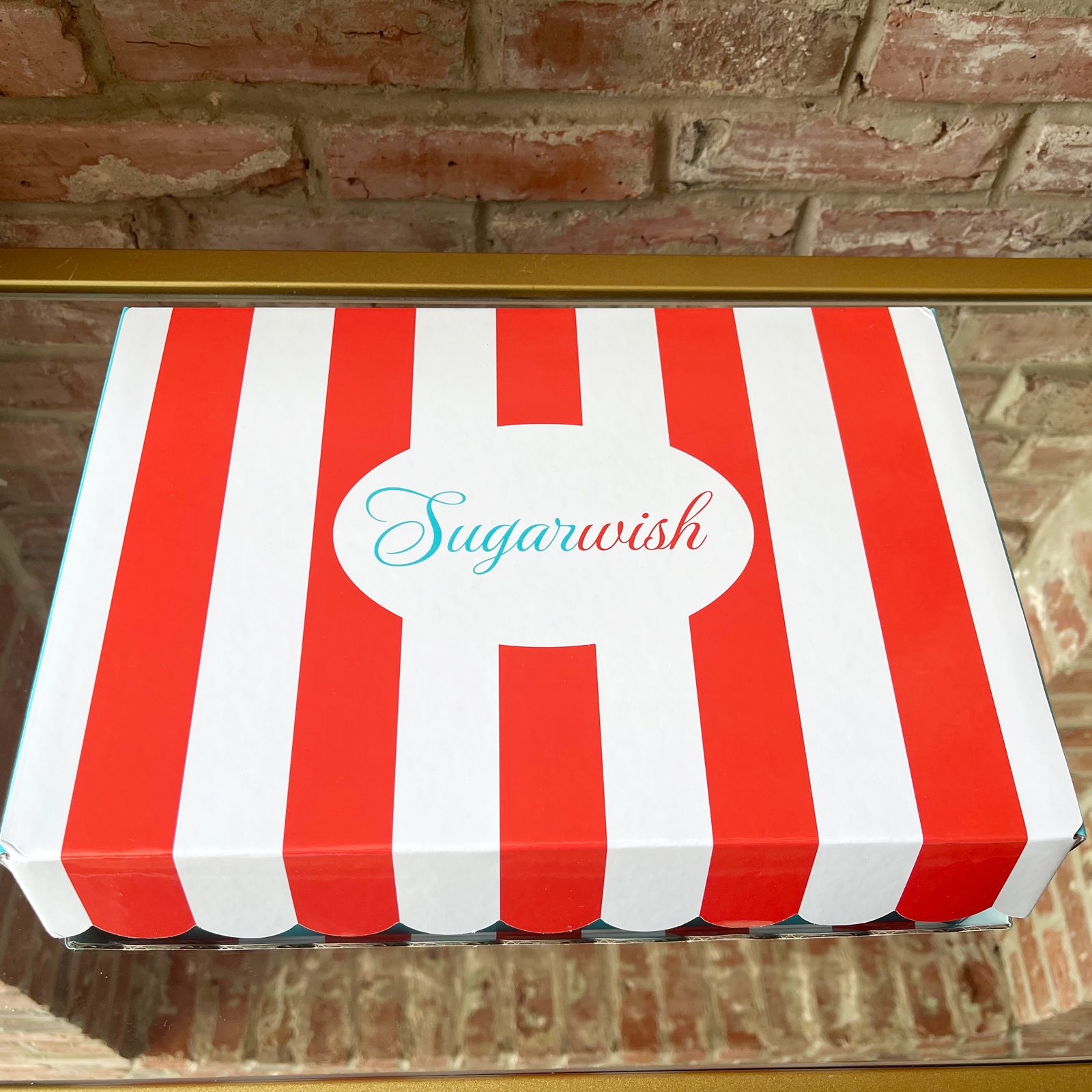 red and white striped outside of a sugar wish box