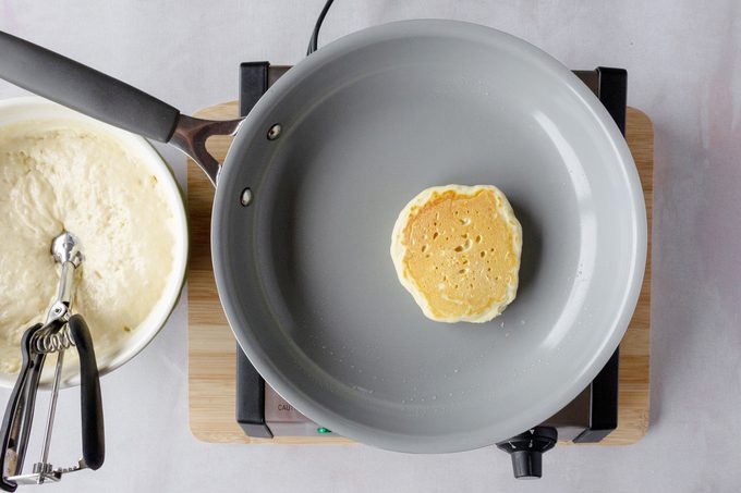 the golden brown side on a pan while cooking a pancake