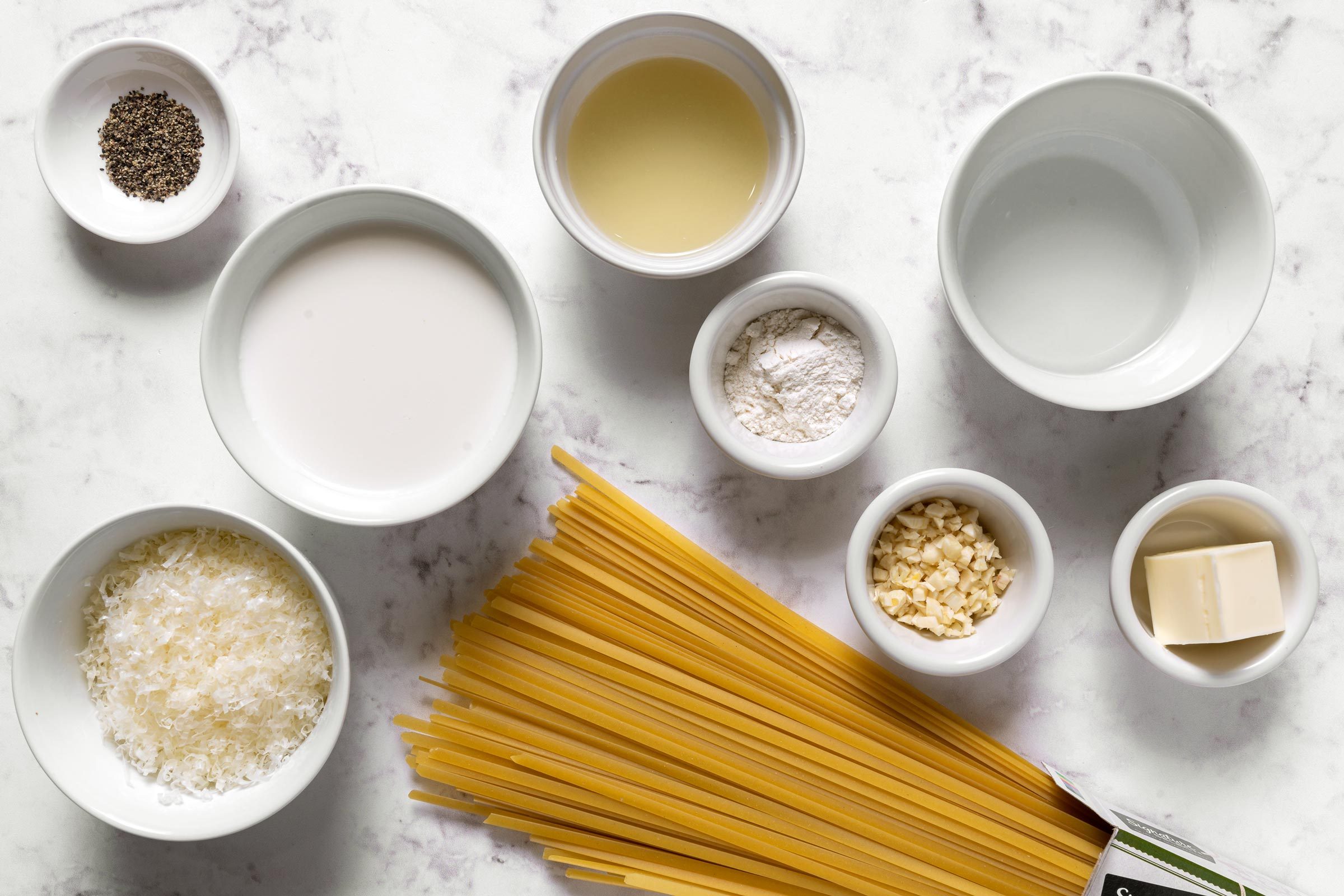 small bowls with measured out ingredients for Christmas fettuccine