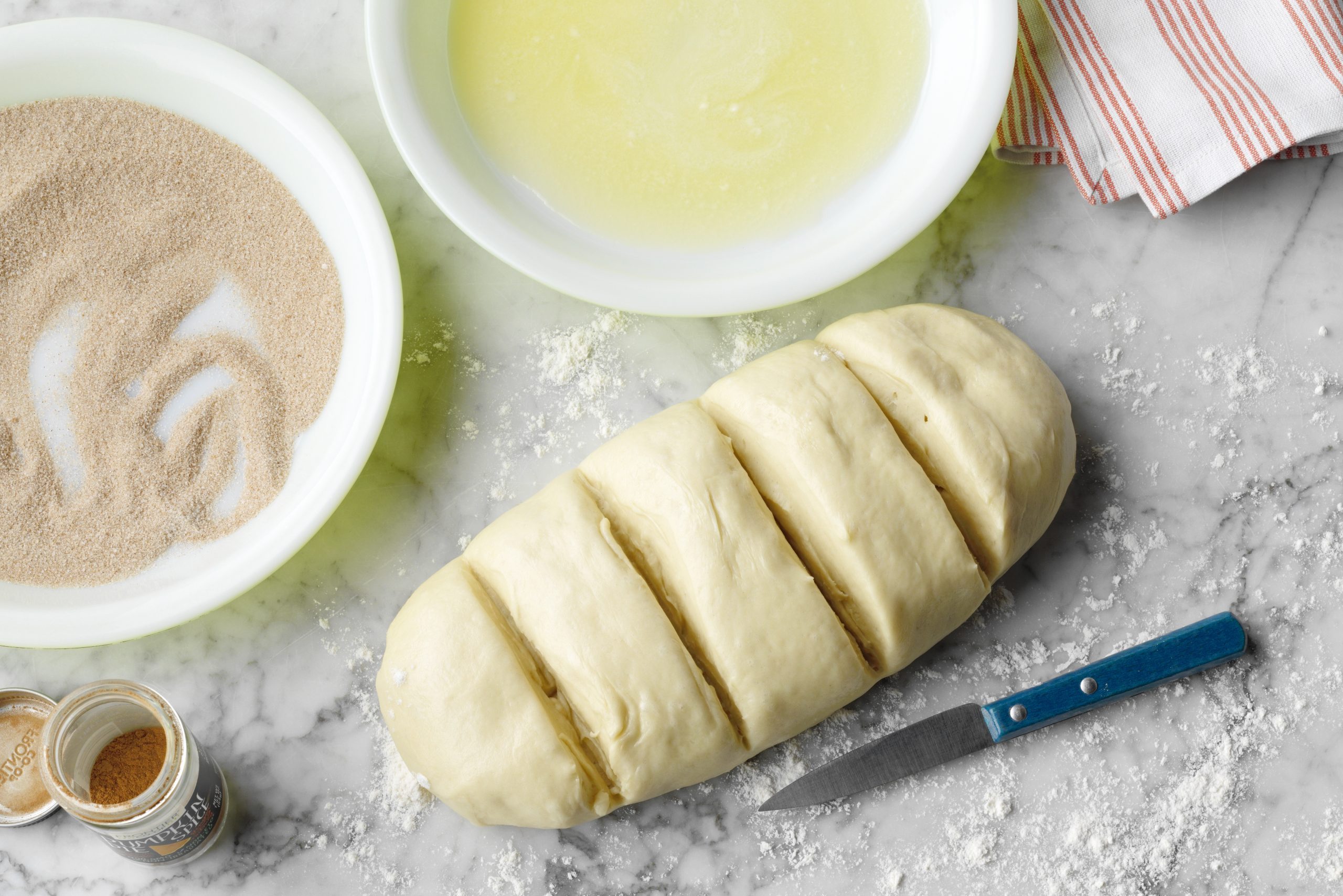 Roll dough in butter and sugar and spice mixture