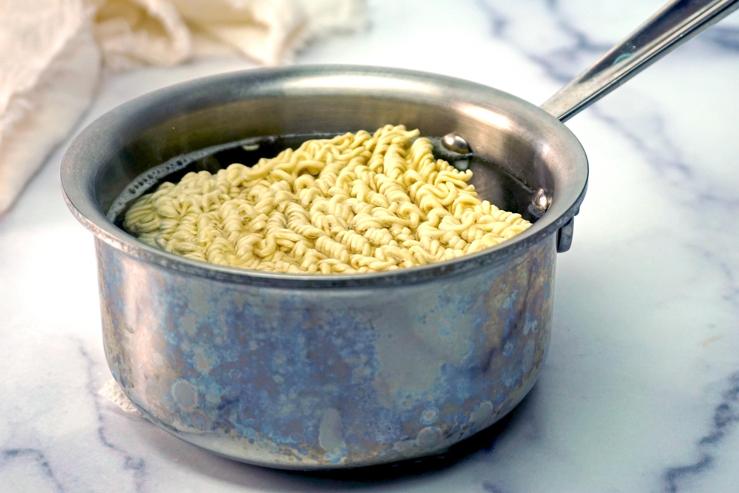 Cheesy Ramen noodles in a pot