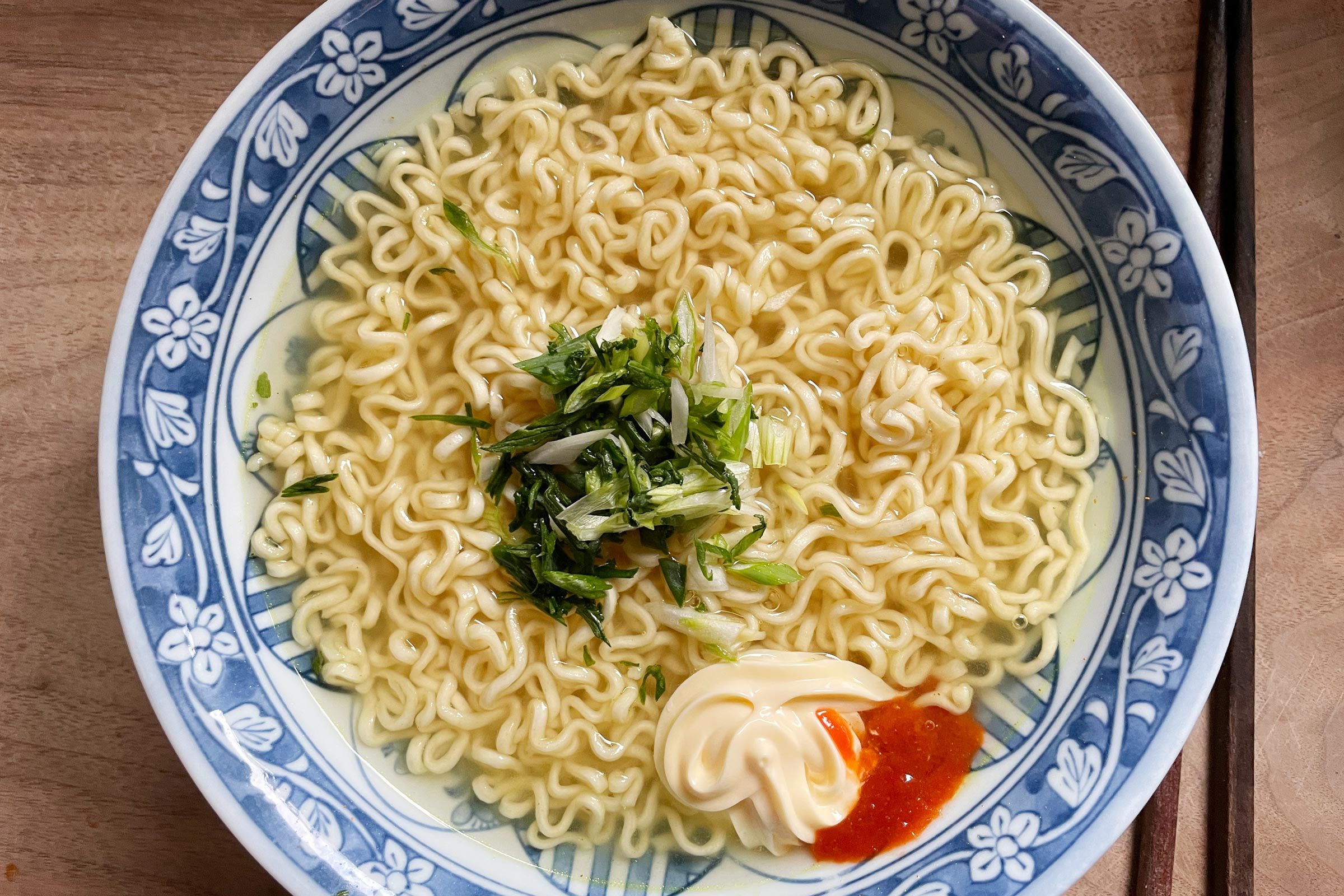 top view of a bowl of ramen with toppings