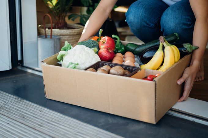 Young Woman Receiving Fresh Food Grocery Delivery