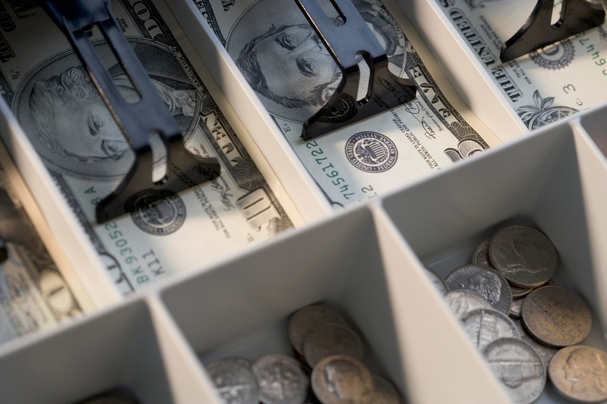 U.S. bills and coins in cash register