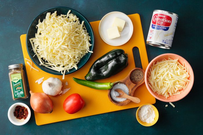 Copycat Chipotle Queso Blanco Ingredients on dark blue background