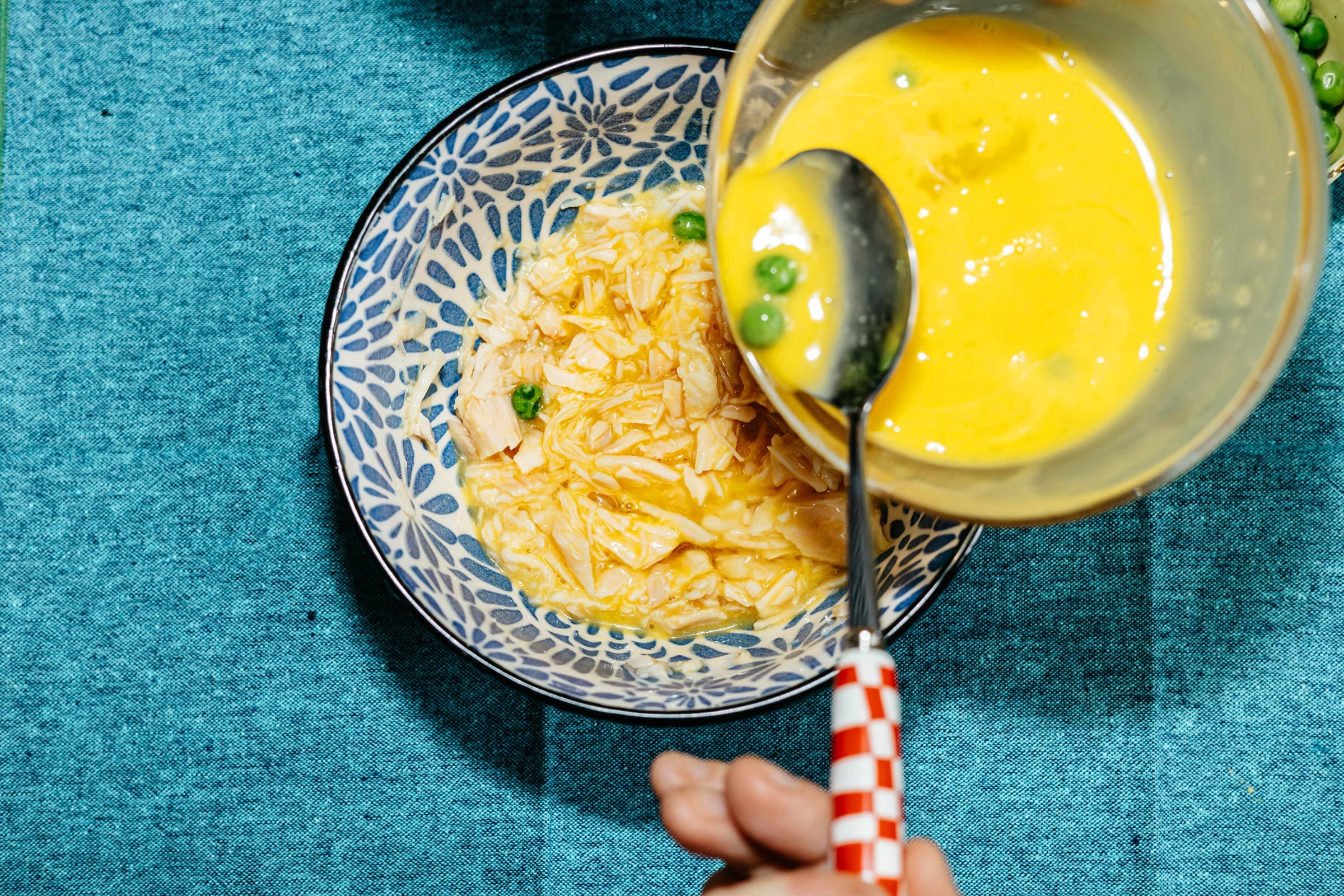 mixing cat cake ingredients in a bowl