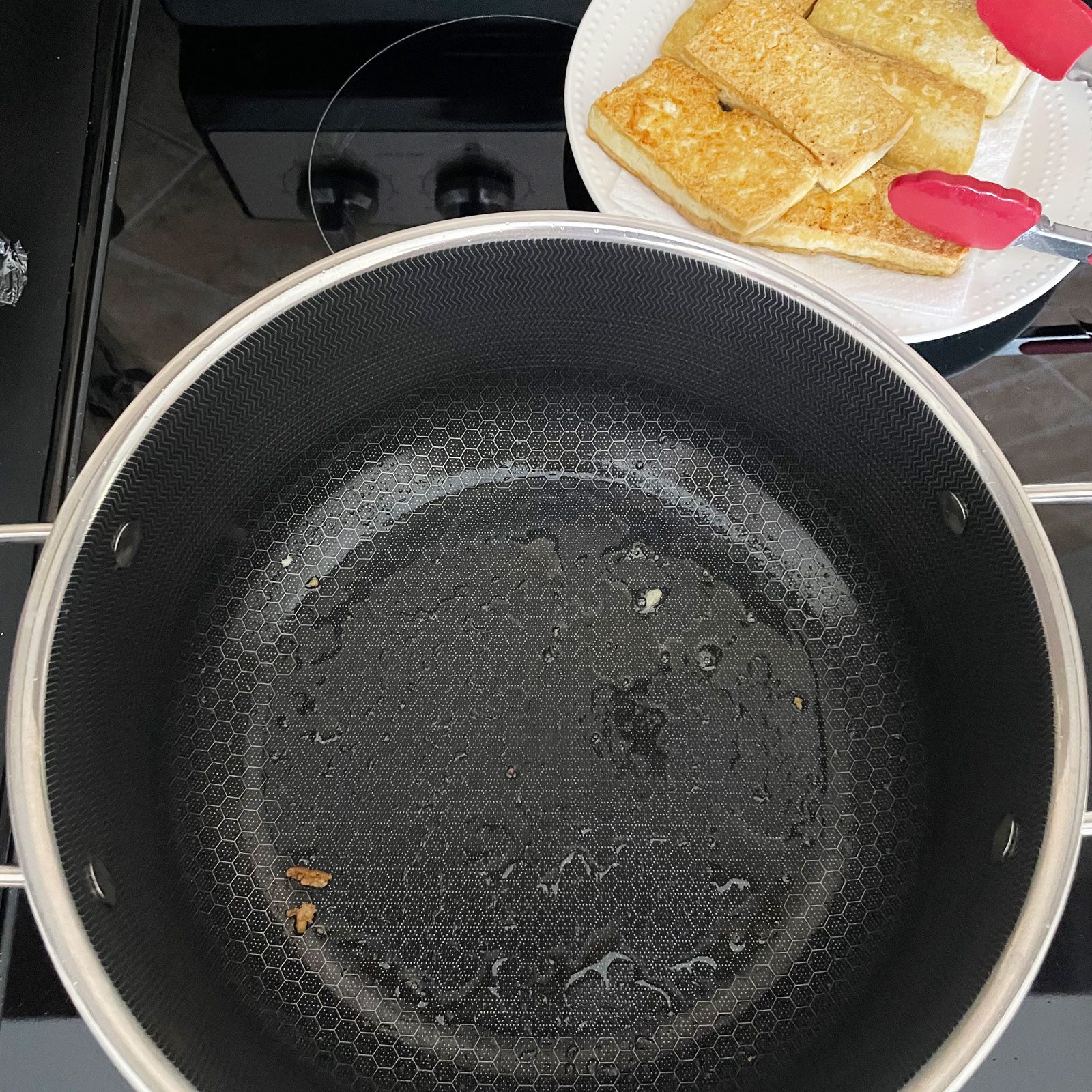 Hexclad pan after removing cooked tofu from the pan