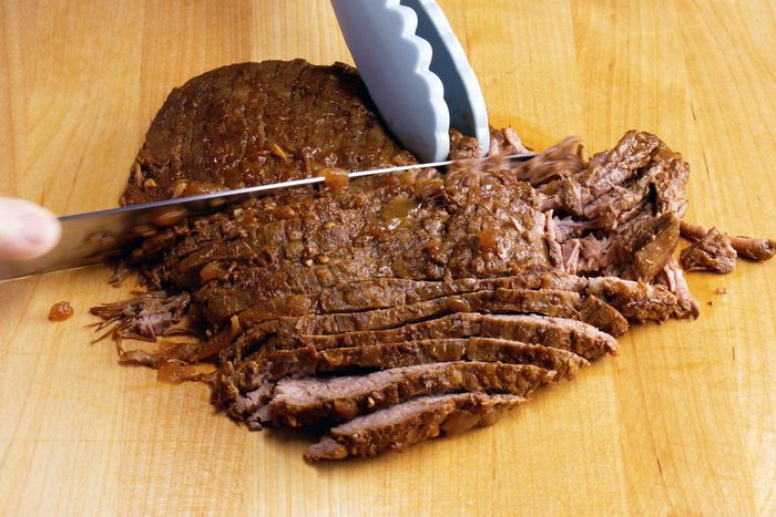 cutting slow cooker carne asada