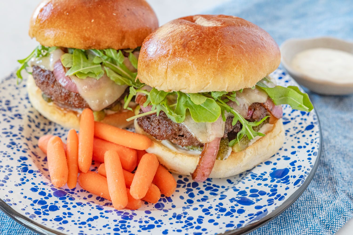 Bistro Cheeseburger gobble meal on a plate with a side of carrots 