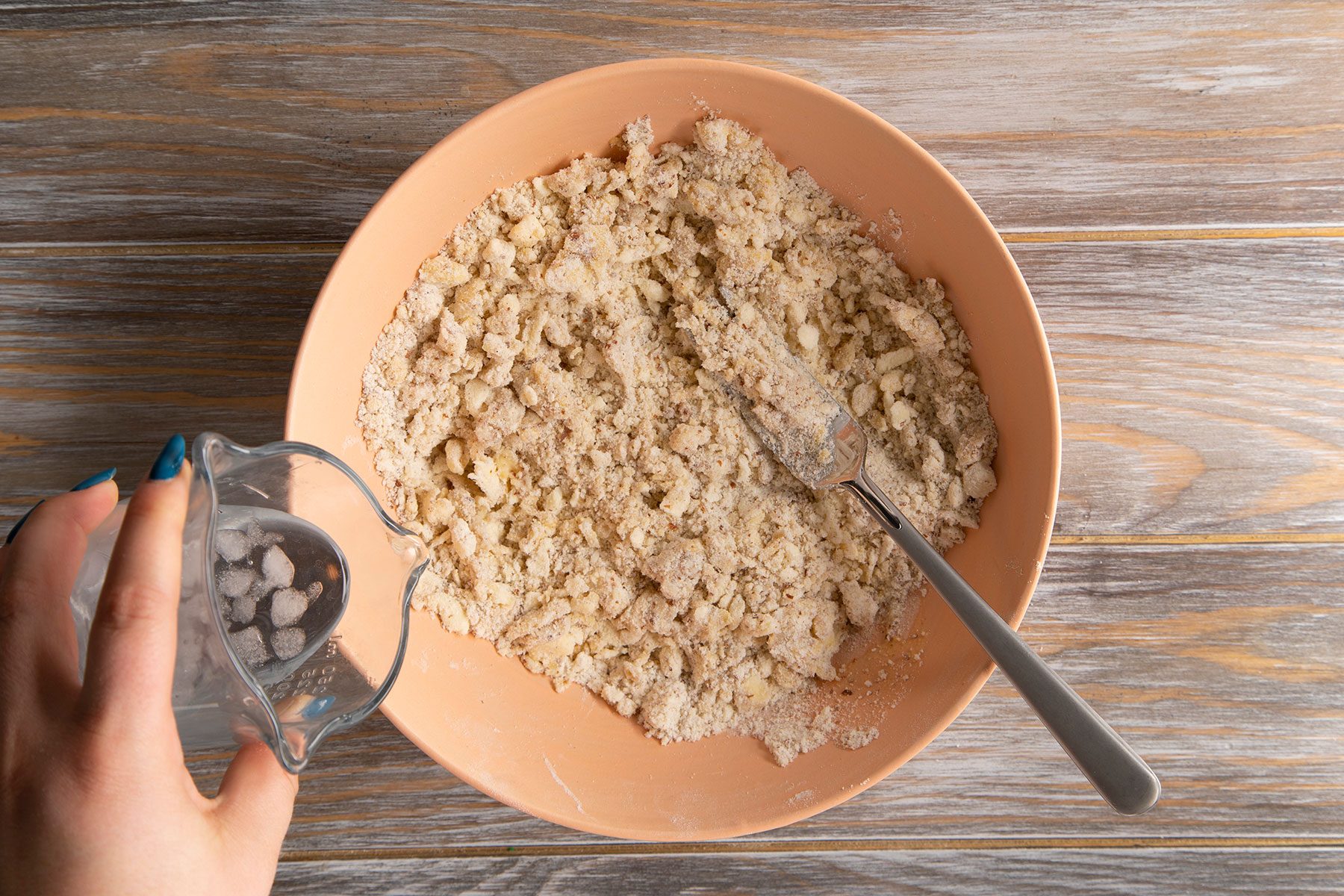 Pouring water on dry ingredients