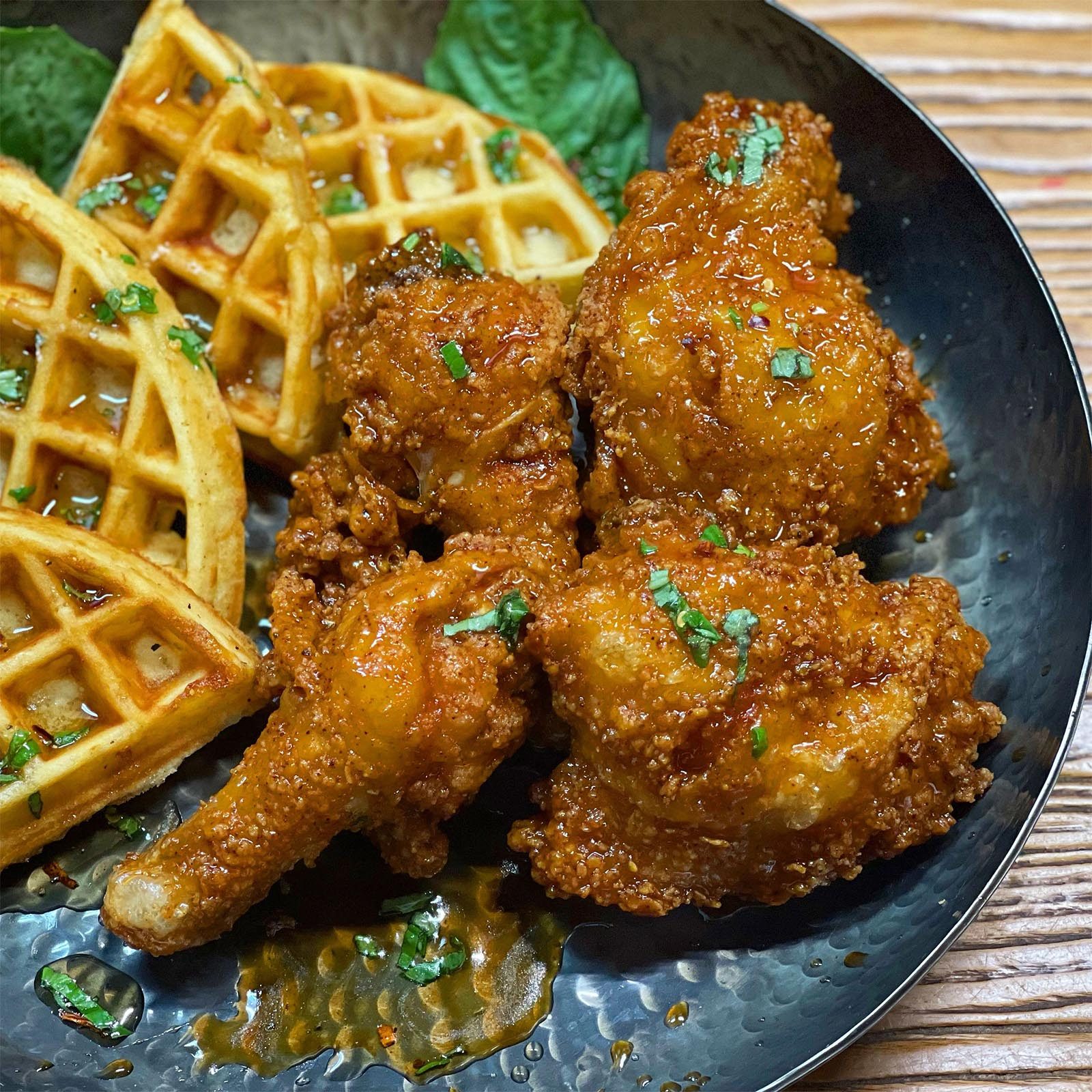 A plate of chicken and waffles from Black Nile Seafood And Soul Food