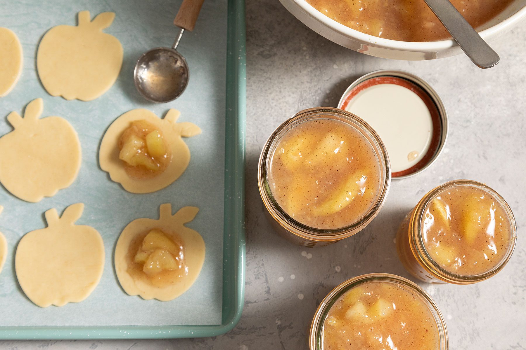 Apple Pie Filling in jars and on cut out pieces of apples