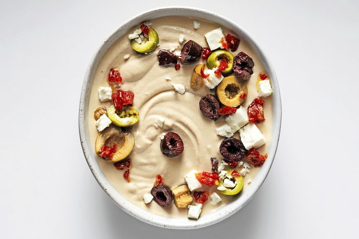 Fresh Hummus served with dryfruits toppings in a small bowl