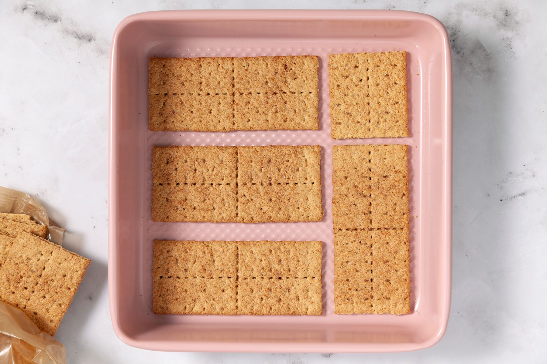 Layering the Pan with Graham Crackers